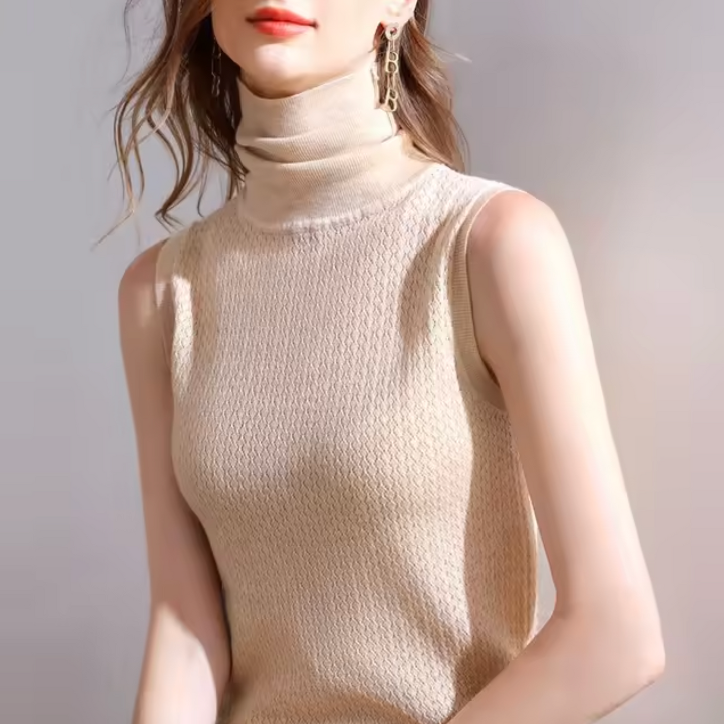 Audrey – Top de punto sin mangas con cuello alto